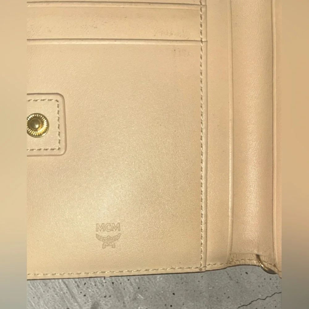 MCM Beige Monogram Tassel Compact Wallet